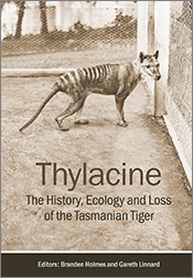 Cover of 'Thylacine' featuring a historical photo of a Tasmanian tiger within an enclosure. Cover of 'Thylacine' featuring a historical photo of a Tasmanian tiger within an enclosure.